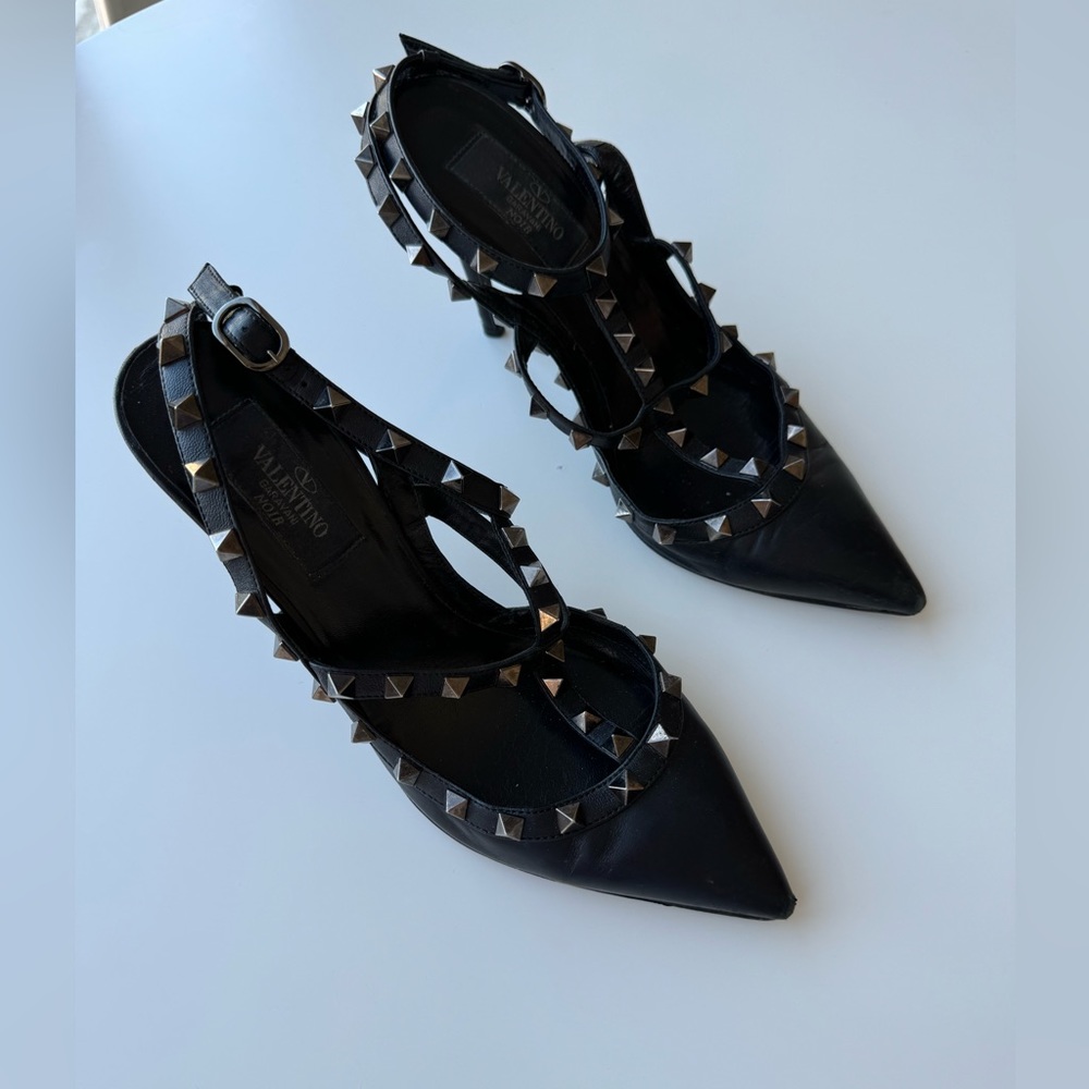 Valentino Garavani rockstud black strappy pumps.